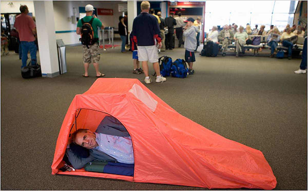 Passenger Sleeping in Terminal