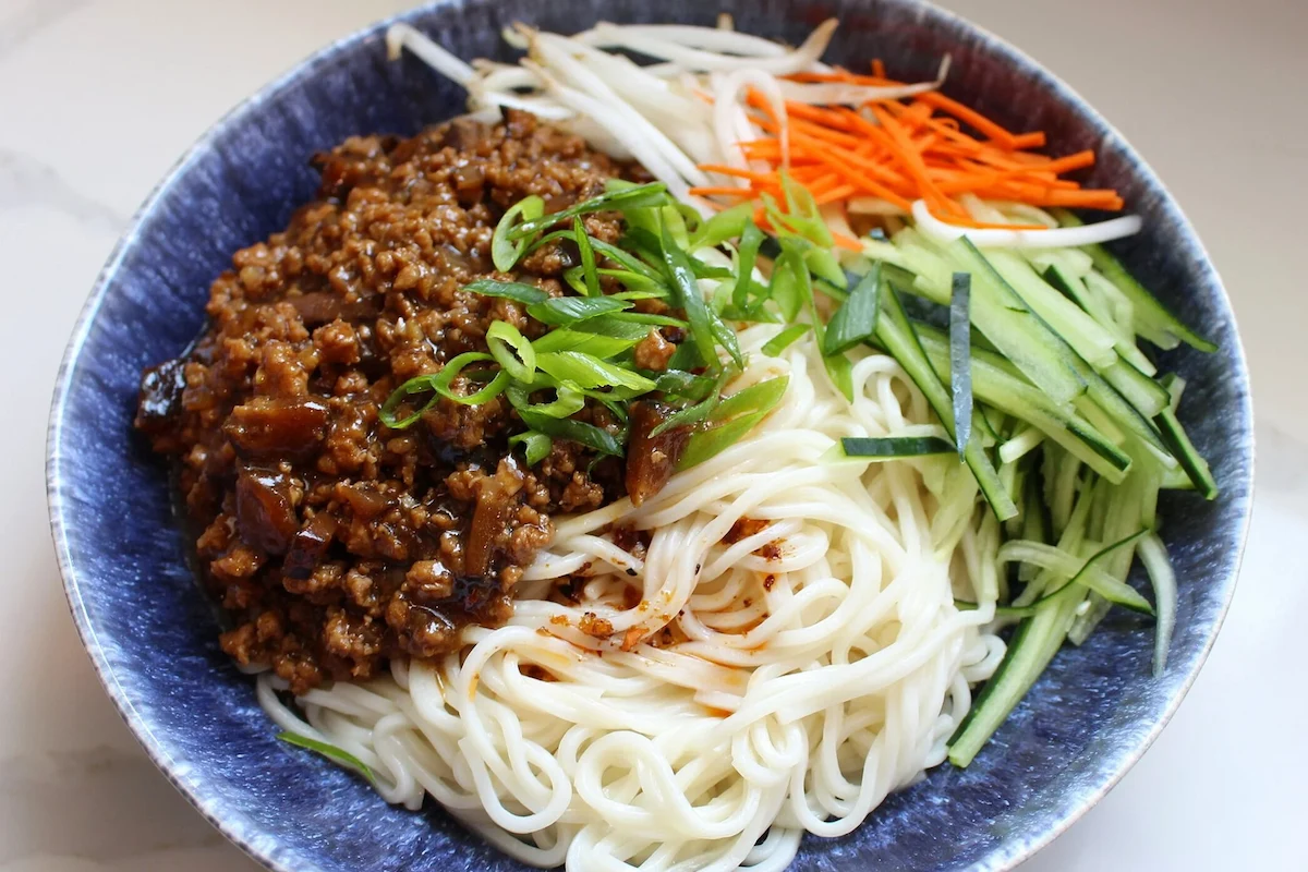 Peking duck served with sweet bean sauce and vegetables