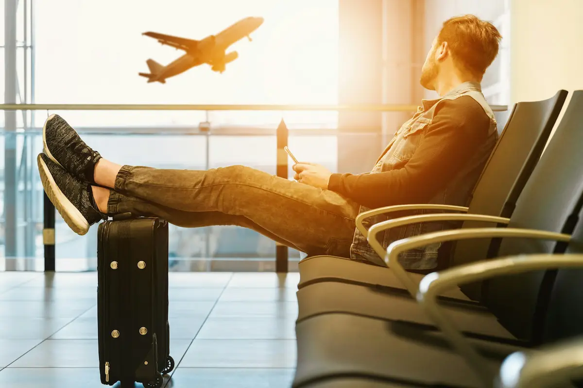 Traveller booking airport lounge access on a smartphone