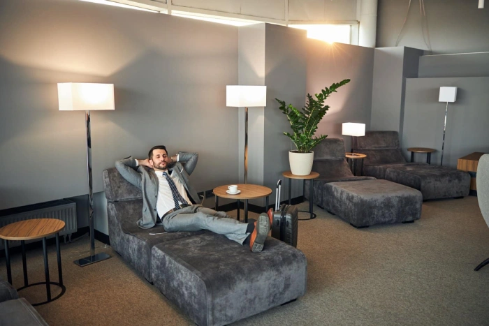  business man relaxing at airport lounge