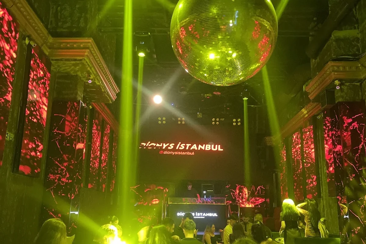 People dancing under disco lights in Dionys
