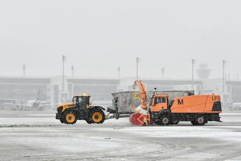 Airport staff preparing aircraft for de-icing
