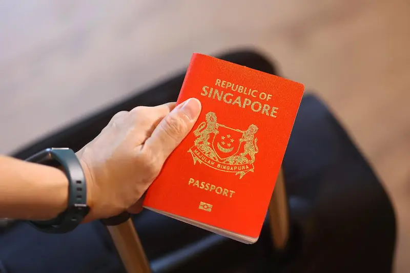 Traveler showing Singapore Passport